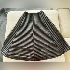 Below the knee a line skirt.